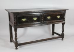 A late 17th century style oak dresser, with two drawers on turned legs with stretchered base, 2ft