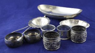 A pair of George VI silver napkin rings, London 1943; two pairs of Eastern napkin rings; a silver