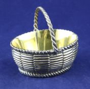 A George III silver salt, in the form of an oval basket, Walter Brind, London, 1783, length 3.5in,