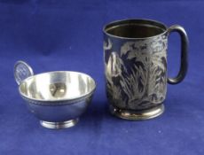 A late Victorian silver christening mug, with engraved initial and date and decorated with stag in