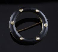 A late Victorian gold, seed pearl and black enamel circular memorial brooch, 1.25in.