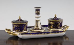 A Derby inkstand, c.1810, of lozenge form, gilt decorated with flowers and leaves on a cobalt blue