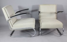 A pair of Ahrend de Cirkel cantilever armchairs, with beige fabric upholstery, ebonised arms and