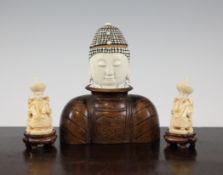 A Chinese ivory and wood bust of Buddha and a pair of ivory figures of seated Emperor and Empress,