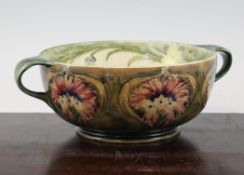 A Moorcroft MacIntyre cornflower design two handled bowl, c.1911, the interior with yellow flowers