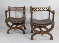 A pair of mid 19th century oak gothic armchairs, in the manner of A.W.N. Pugin, c.1850, with