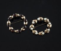 A gold and garnet set circular brooch, of foliate design and a similar gold and cultured pearl set