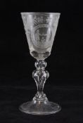 A large Dutch drinking glass, late 19th century, wheel engraved with two gentleman toasting each