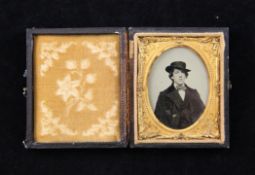 Oscar Wilde (1854-1900). A cased ambrotype head and shoulders portrait, circa 1882, 1/9 plate, in