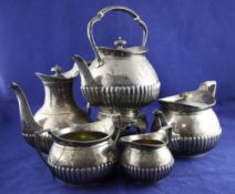 A late Victorian five piece demi fluted silver tea and coffee service, by Walter & John Barnard,