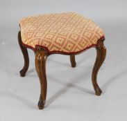 A Victorian carved walnut serpentine stool, on cabriole legs, 1ft 4in. x 1ft 4in.