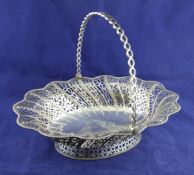 A George III pierced silver shaped oval cake basket, with foliate and beaded decoration and