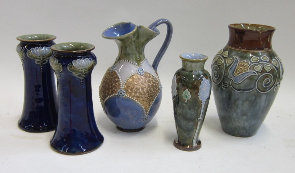 A group of Doulton stoneware Vases and a Jug including a pair of dark blue glazed tapering