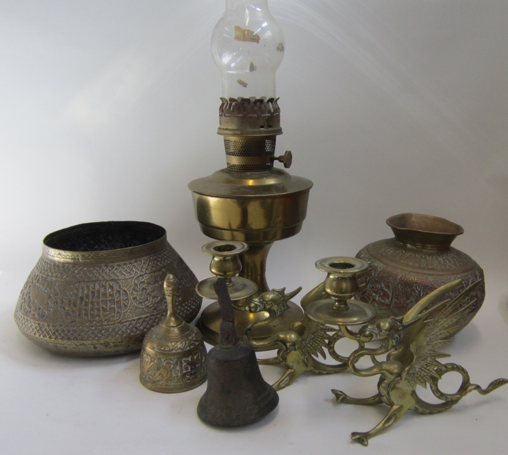 Brassware including a pair of dragon Candlesticks, Oil Lamp, Eastern Vase and Bowls, Bell etc