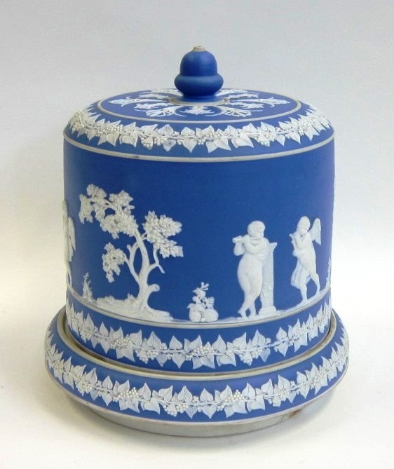 A Wedgwood style blue Jasperware Cheese Dome and Stand. Apparently unmarked. Decorated with putti in