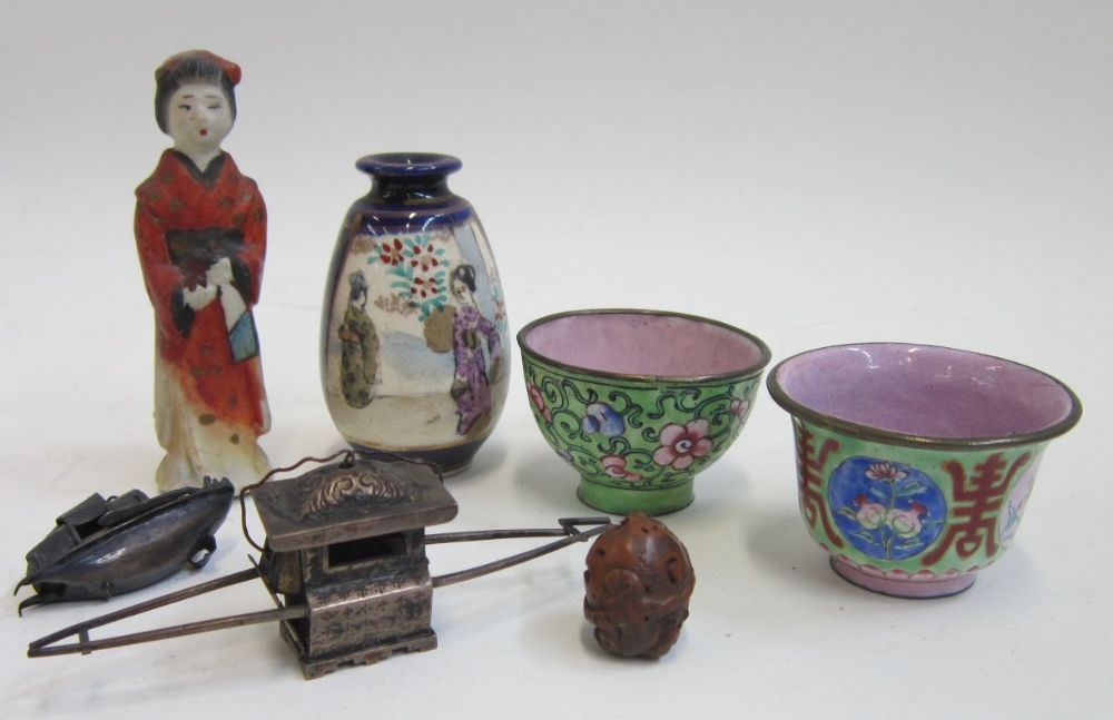 A group of Oriental miniature items comprising: a silver Toy, Hung Chong; another damaged silver