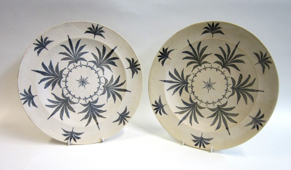 A pair of Japanese studio pottery Chargers with stylised foliate decoration Signed to the reverse