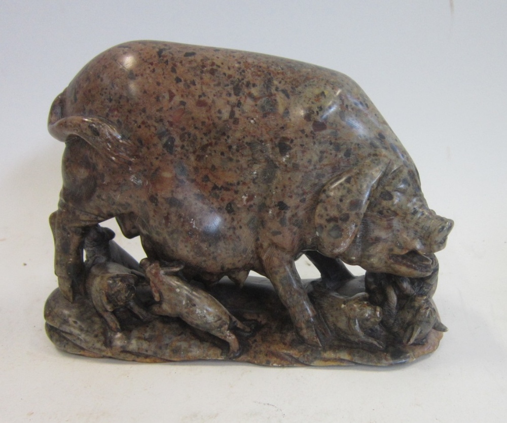 A Chinese carved stone group of a Pig and her Piglets. 17 cms wide