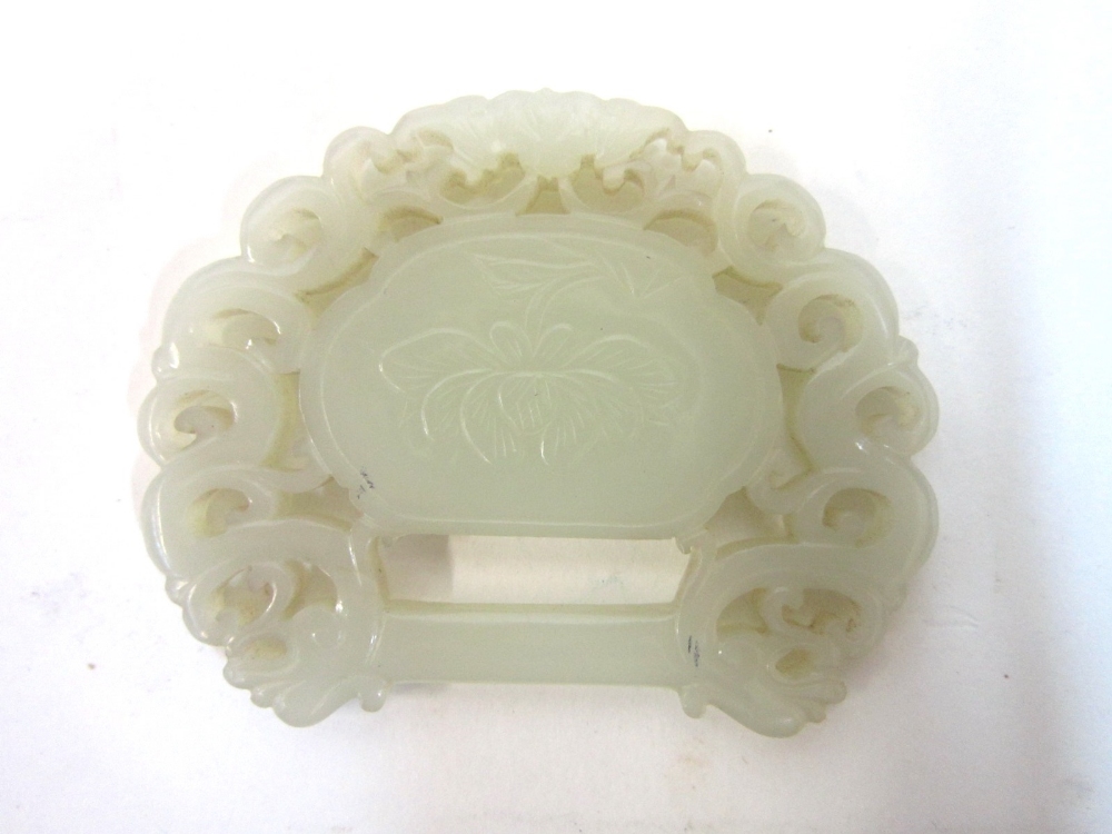 A Chinese pale celadon jade Carving, possibly partial belt buckle with bat, dragon and scrolling