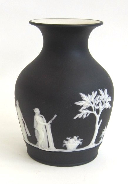 A Wedgwood black Jasperware Vase. Circa 1900 Decorated with classical figures emblematic of the Arts