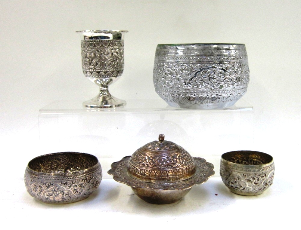 A group of five Indian metalware items comprising three bowls of various sizes; a bowl and cover