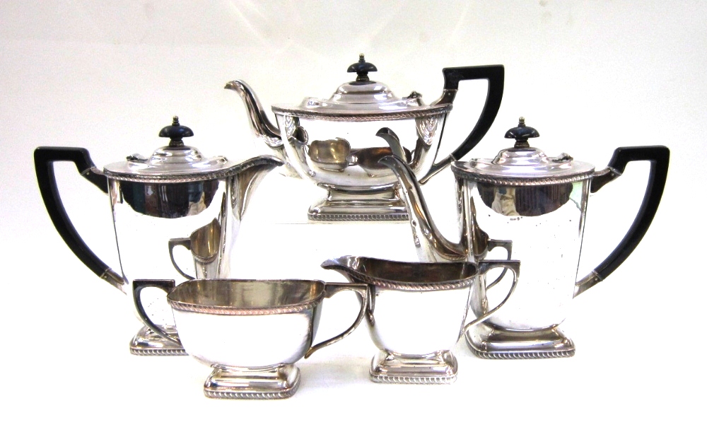 An electroplate five piece Tea and Coffee Service with gadroon borders on pedestal foot. The