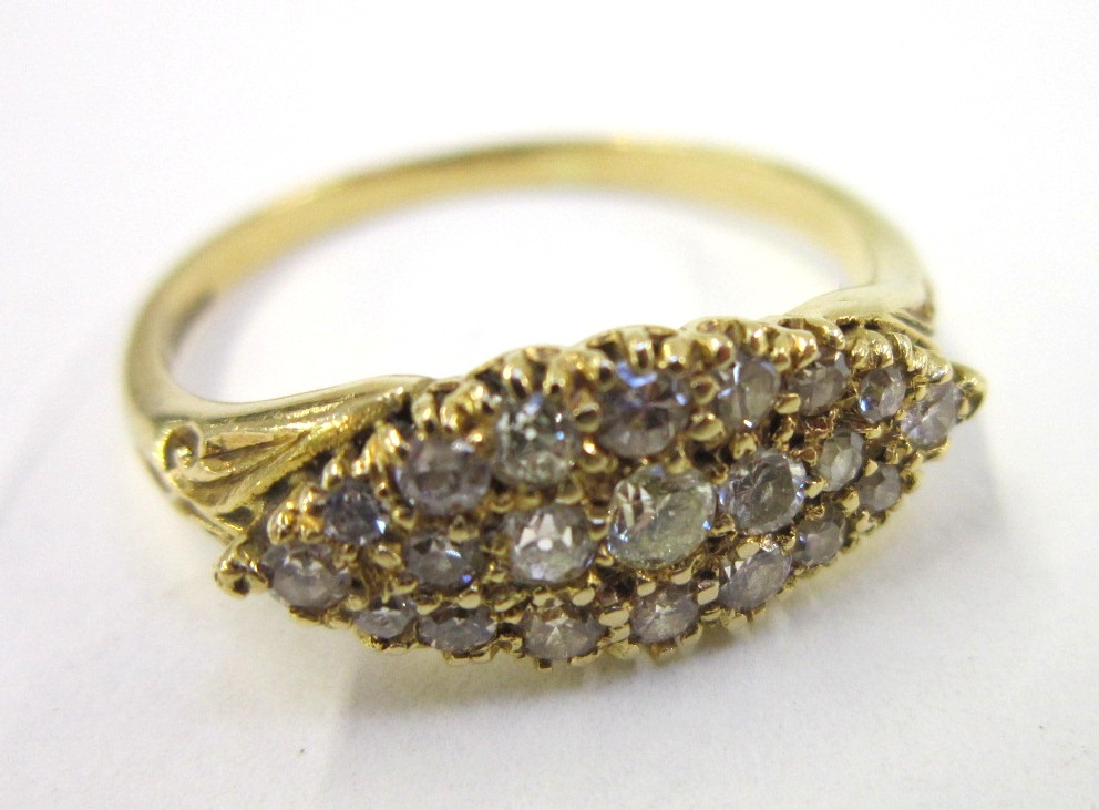 An 18 carat gold and diamond cluster Ring, set with 21 brilliant cut stones