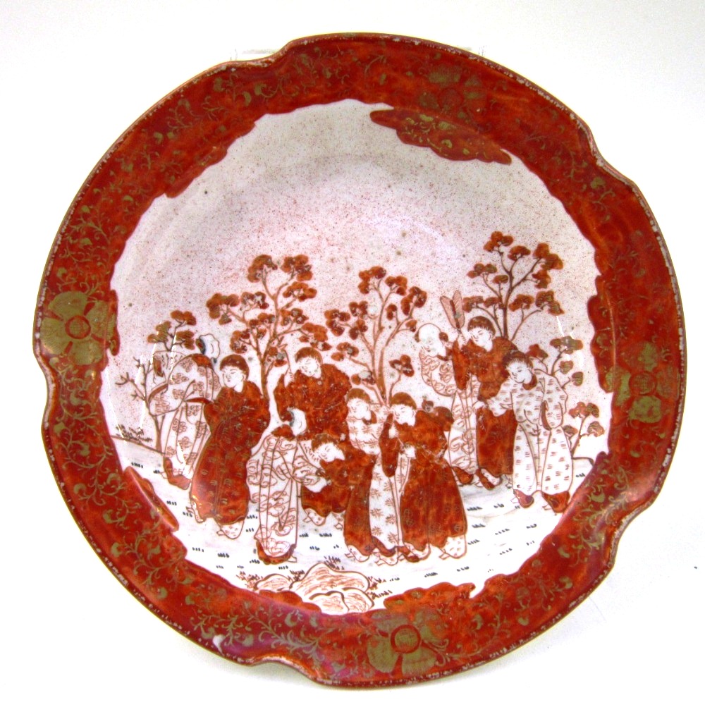 A Japanese Kutani footed shallow bowl/tazza Decorated in iron red with numerous figures within an