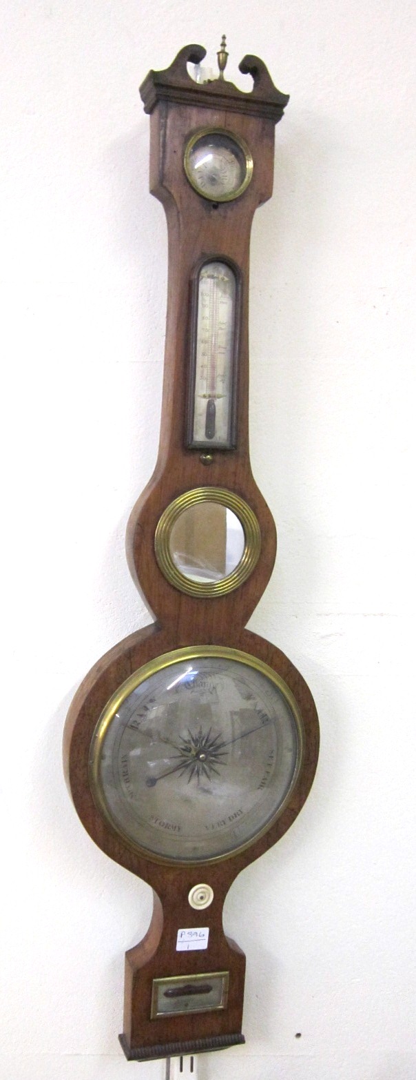 A 19th Century wheel Barometer and Thermometer signed P Corti, Exeter with silvered dials, the