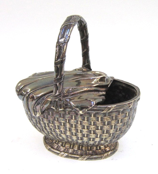 An unusual Elkington silver plated Spoon Warmer modelled as a basket, date code for 1882 13.5cm wide