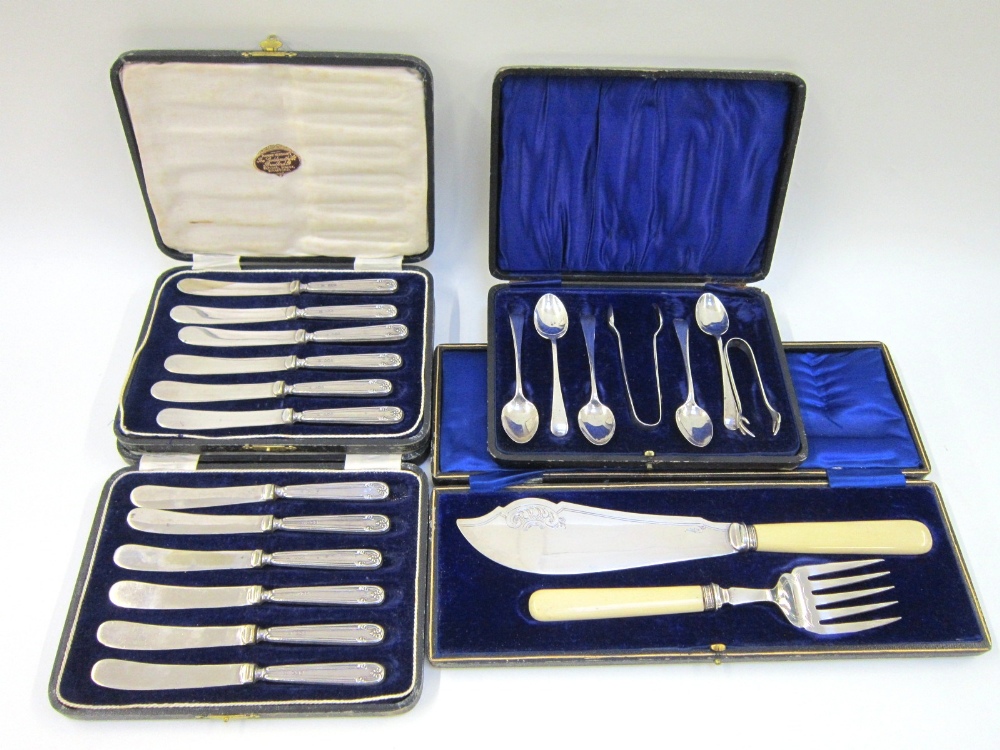 A set of 12 silver handled Butter Knives. Sheffield 1920 Together with a set of 5 silver Teaspoons