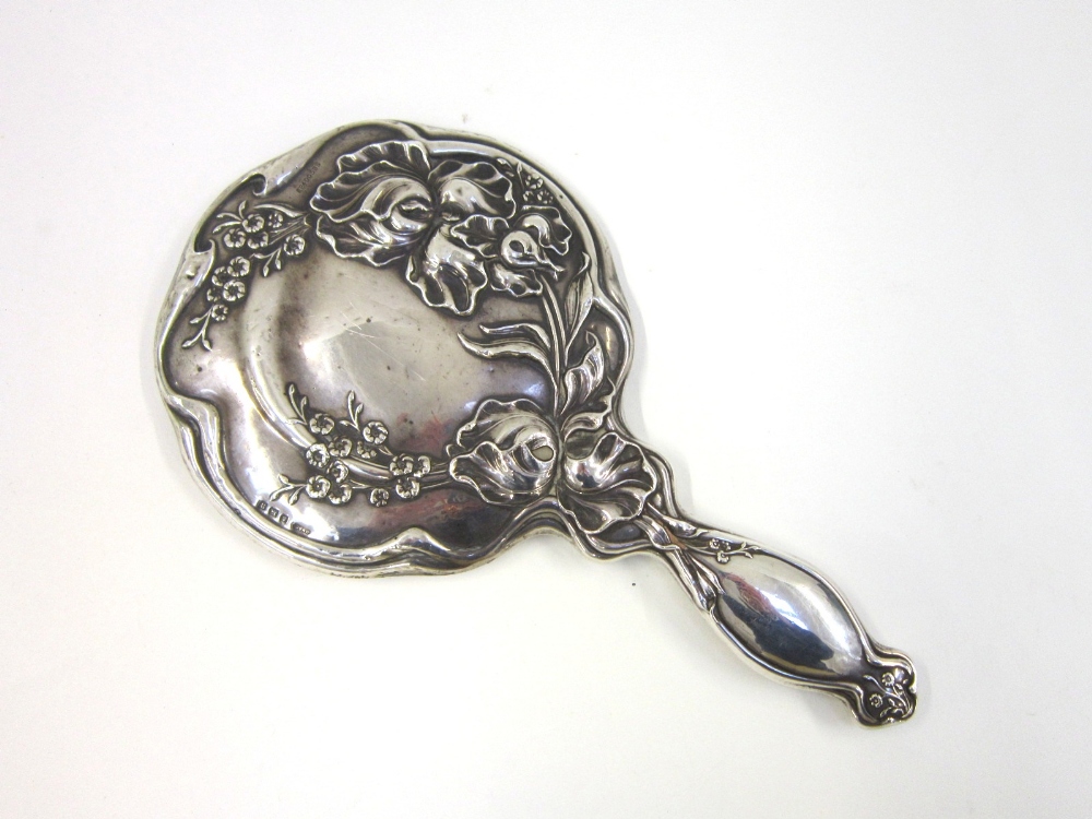 An Art Nouveau silver Hand Mirror, Birmingham 1912, chased with stylised foliage. 28 cms long