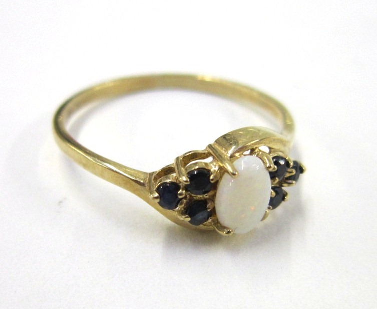 A 9ct gold white opal and diamond Ring