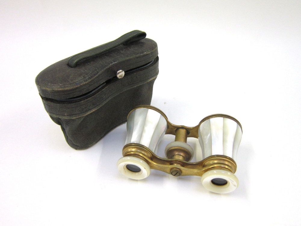 A pair of mother of pearl and gilt brass Opera Glasses in leather case