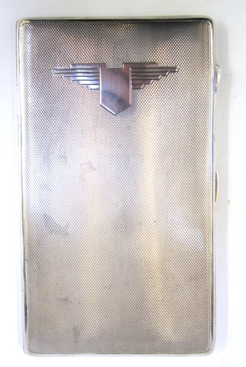 An engine turned silver Cigarette Case. Birmingham 1943, oblong with stylised reserve to the front.