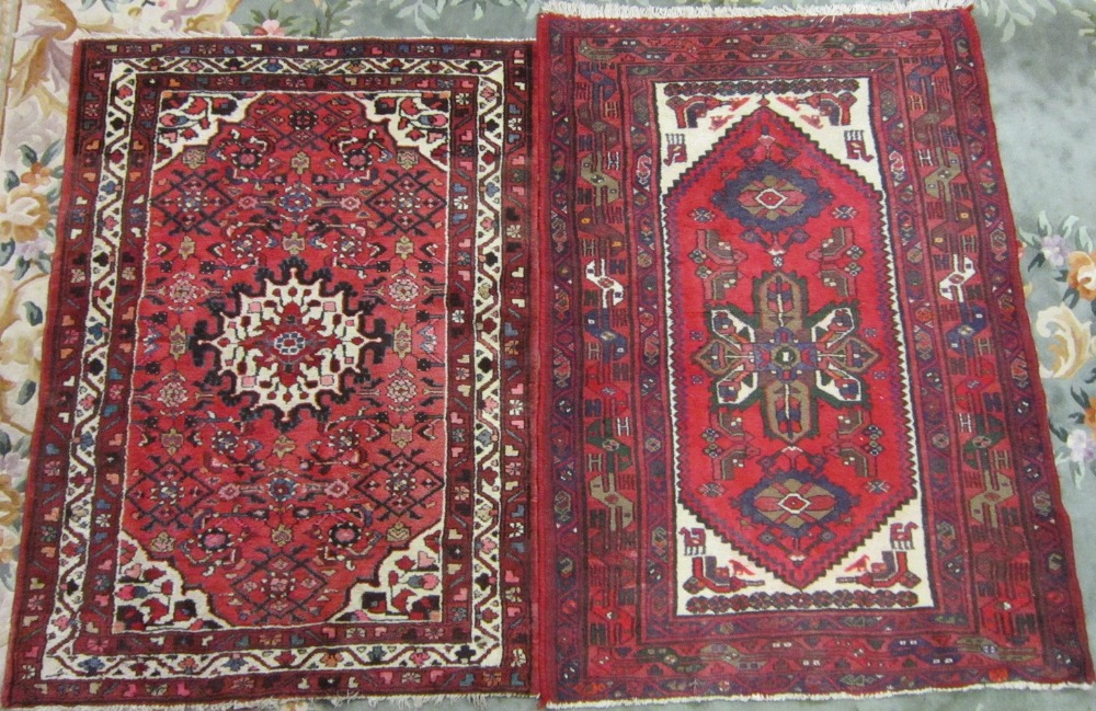 A Persian Hamadan small Rug, Hussainabad on a red ground; together with another Hamadan Rug of