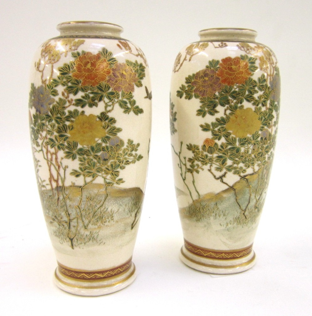 A pair of Japanese Satsuma Vases, decorated with flowering foliage, 16 cms