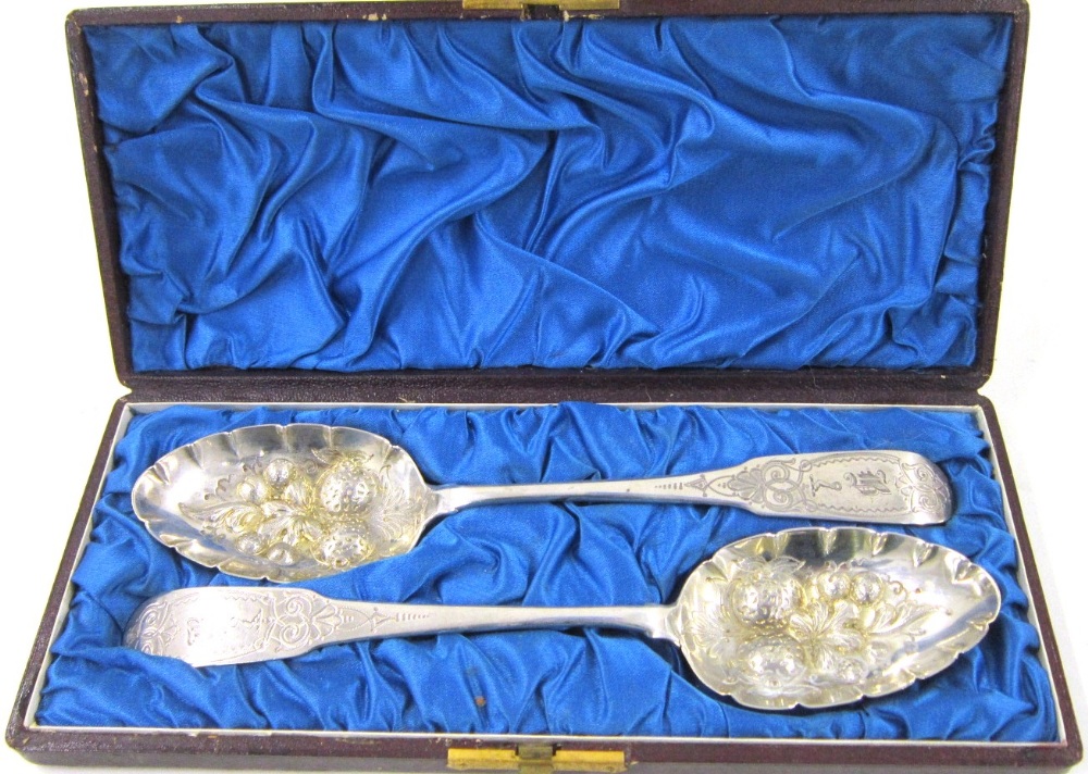 A pair of Irish George III silver Berry Spoons. No maker`s mark, Dublin, 1800. The terminals