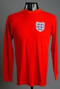 Cyril Knowles`s red England No.14 jersey from the 1968 European Nations` Cup, long-sleeved. Squad