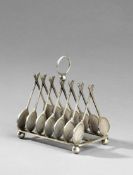 An electroplated toast rack designed with crossed racquets, length 16cm., 6 1/4in.