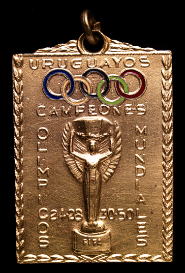 A gilt-metal & enamel medal presented by the Uruguayan Football Association to the 1950 World Cup