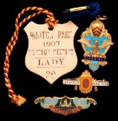 Three gilt-metal & enamel member`s badges for defunct racecourses, Cardiff 1902, Gatwick 1905 &
