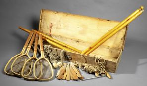 An intriguing early circa 1878/1880 pine-boxed French lawn tennis set, the rustic pine box,