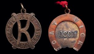 A rare member`s badge for the very first season of racing at Gatwick in 1891, horse shoe shaped,