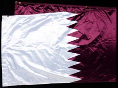 The national flag of Qatar that flew at the Olympic Village at the 2012 London Games
