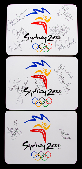 A group of three autographed boxed Sydney 2000 Olympic Games souvenir table mats, i) signed by the