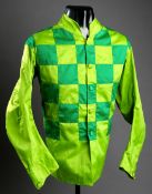 An original jockey`s jacket in the green & light green check colours of the famous American