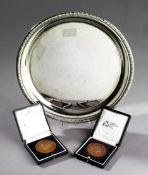 Two medals and a salver presented to the Middlesex CCC scorer Eddie Solomon, the two cased bronze