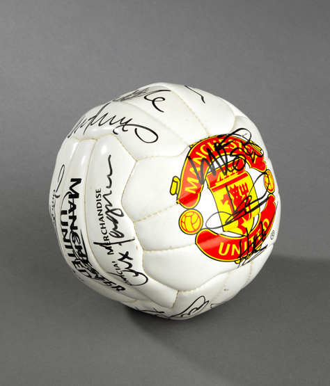 A football signed by the Manchester United 1999 Treble Winners, 18 signatures in black marker pen