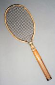 A Slazengers `Steel` lawn tennis racquet with wire strings 1924, cream painted steel head frame